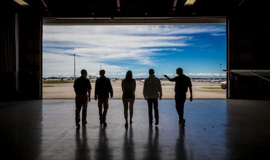 pilots walking from hangar